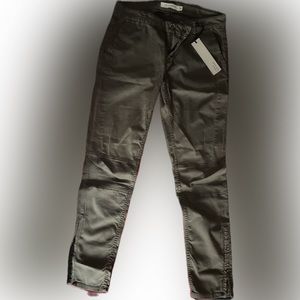 NWT. Olive skinny jeans with zipper ankles.